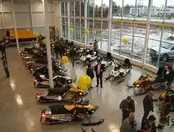 A showroom grand opening, snowmobiles on display