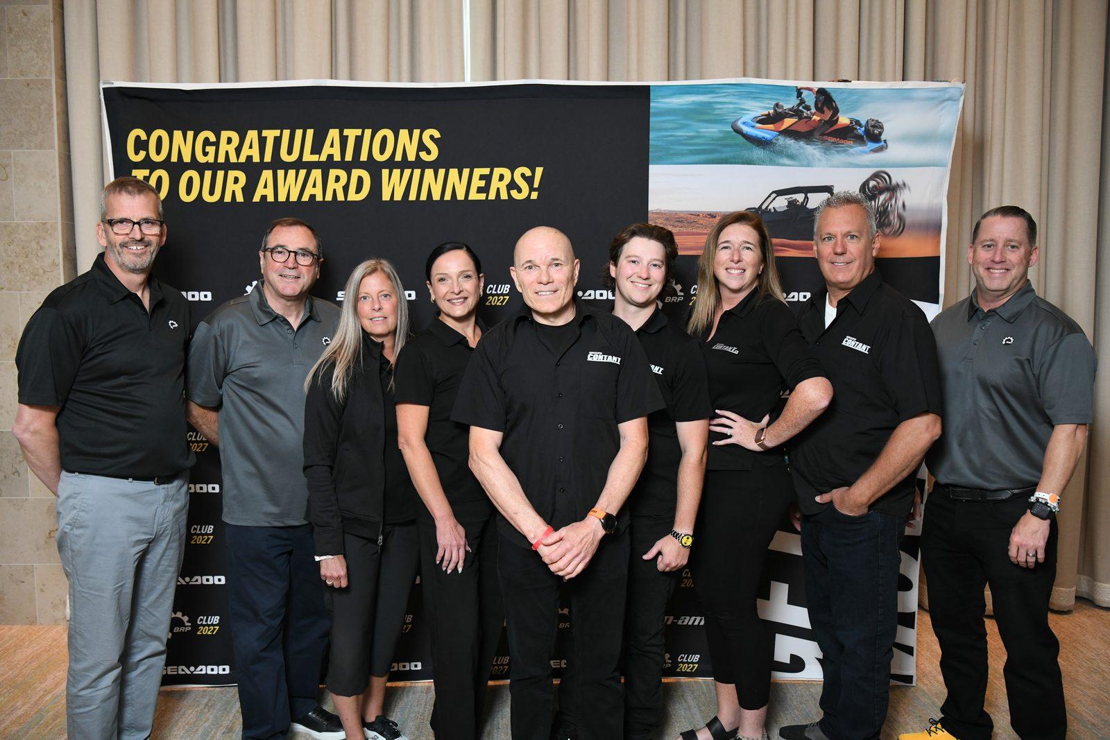 The Groupe Contant team in front of the Club BRP 2027 award winners' backdrop